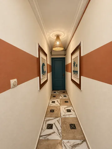 A corridor through the house with warm walls and Moroccan details