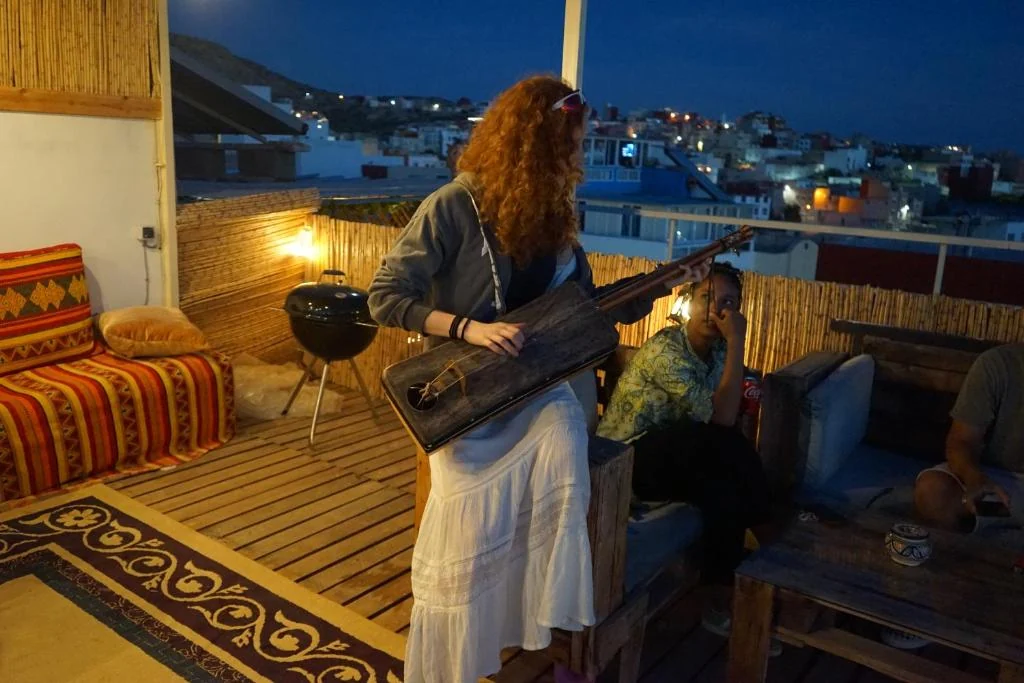 Music on the Dar Swell rooftop terrace after sunset